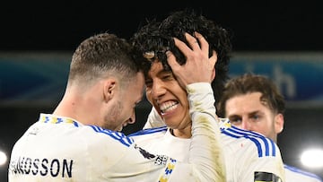 Leeds United's Japanese midfielder #22 Ao Tanaka (C) celebrates with Leeds United's Swedish defender #03 Gabriel Gudmundsson (L) after scoring Leeds' second goal during the English Premier League football match between Leeds United and Chelsea at Elland Road in Leeds, northern England, on December 3, 2025. (Photo by Oli SCARFF / AFP) / RESTRICTED TO EDITORIAL USE. No use with unauthorized audio, video, data, fixture lists, club/league logos or 'live' services. Online in-match use limited to 120 images. An additional 40 images may be used in extra time. No video emulation. Social media in-match use limited to 120 images. An additional 40 images may be used in extra time. No use in betting publications, games or single club/league/player publications. /