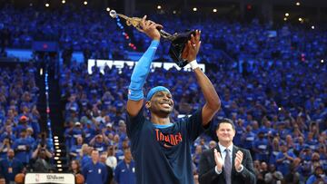 OKLAHOMA CITY, OKLAHOMA - MAY 22: Shai Gilgeous-Alexander #2 of the Oklahoma City Thunder accepts the MVP Michael Jordan Trophy prior to a game against the Minnesota Timberwolves in Game Two of the Western Conference Finals of the 2025 NBA Playoffs at Paycom Center on May 22, 2025 in Oklahoma City, Oklahoma. NOTE TO USER: User expressly acknowledges and agrees that, by downloading and or using this photograph, User is consenting to the terms and conditions of the Getty Images License Agreement. Matthew Stockman/Getty Images/AFP (Photo by MATTHEW STOCKMAN / GETTY IMAGES NORTH AMERICA / Getty Images via AFP)