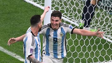 13 December 2022, Qatar, Lusail: Soccer, World Cup, Argentina - Croatia, final round, semifinal, Lusail Stadium, Argentina's Julian Alvarez cheers with Argentina's Lionel Messi/ after scoring to make it 0-2. Photo: Robert Michael/dpa (Photo by Robert Michael/picture alliance via Getty Images)