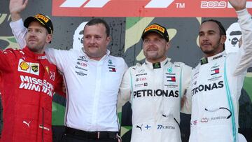 SUZUKA, JAPAN - OCTOBER 13: Top three finishers Valtteri Bottas of Finland and Mercedes GP, Sebastian Vettel of Germany and Ferrari and Lewis Hamilton of Great Britain and Mercedes GP celebrate on the podium during the F1 Grand Prix of Japan at Suzuka Circuit on October 13, 2019 in Suzuka, Japan. (Photo by Charles Coates/Getty Images)