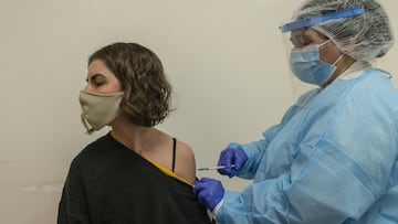 MONTEVIDEO, URUGUAY - AUGUST 28: A citizen receives a dose of vaccine during a vaccination day as part of the vaccination campaign against COVID-19 on August 28, 2021 in Montevideo, Uruguay. According to the Uruguayan Health Department 70% of the population has already received two doses. A third booster shot will be available for citizens who received the Sinovac vaccine and those with comorbidity. Uruguay leads along Chile the highest percentage of its population with two doses applied in South America. (Photo by Ernesto Ryan/Getty Images)
