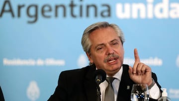 Argentine President Alberto Fernandez gestures as he offers a press conference to announce new measures regarding the lockdown to slow the spread of the novel coronavirus COVID-19, at Olivos Residence in Olivos, north of Buenos Aires, on May 23, 2020. - The pandemic has killed at least 338,128 people worldwide since it surfaced in China late last year, according to an AFP tally at 1100 GMT on Saturday based on official sources. (Photo by Alejandro PAGNI / AFP)