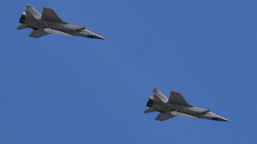 (FILES) This file photo taken on May 9, 2018 shows Russia&#039;s MiG-31 supersonic interceptor jets carrying hypersonic Kinzhal (Dagger) missiles flying over Red Square during the Victory Day military parade in Moscow. - Russia used its newest Kinzhal hyp