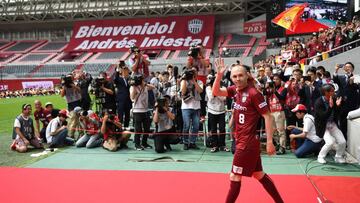 Spanish midfielder Andres Iniesta salutes fans as he enters the pitch of Noevir Stadium, the home stadium for the Vissel Kobe football team, in Kobe on May 26, 2018.
 Barcelona legend Andres Iniesta on May 26 made his first appearance at Vissel Kobe since