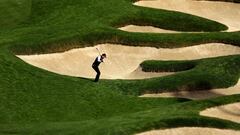 Lee Hodges of the United States plays a shot from a bunker on the 11th hole during the first round of the AT&T Pebble Beach Pro-Am.