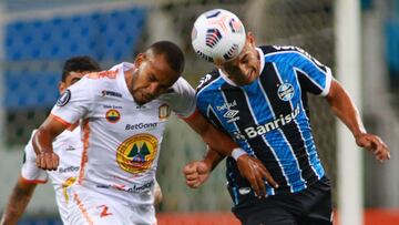 Porto Alegre (Brazil), 10/03/2021.- Diego Souza (R) of Gremio vies for the ball with Hector Salazar (L) of Ayacucho during the Copa Libertadores soccer match between Gremio and Ayacucho FC at Arena do Gremio stadium in Portoa Aegre, Brazil, 10 March 2021.