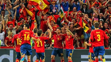 DONETSK, UKRAINE - JUNE 23:  Xabi Alonso of Spain celebrates after scoring the first goal with team mates during the UEFA EURO 2012 quarter final match between Spain and France at Donbass Arena on June 23, 2012 in Donetsk, Ukraine.  (Photo by Martin Rose/