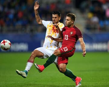 Spain's midfielder Dani Ceballos (L) and Portugal's midfielder Kevin Rodrigues vie for the ball