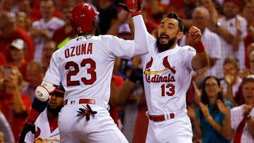 ST. LOUIS, MO - SEPTEMBER 16: Matt Carpenter #13 of the St. Louis Cardinals celebrates with Marcell Ozuna #23 of the St. Louis Cardinals after Ozuna hit a home run against the Los Angeles Dodgers in the second inning at Busch Stadium on September 16, 2018