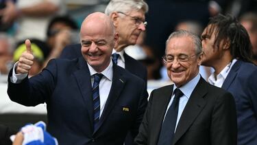 FIFA President Gianni Infantino and Real Madrid President Florentino Perez greet fans ahead of the FIFA Club World Cup 2025 round of 16 football match between Spain's Reald Madrid and Italy's Juventus at the Hard Rock Stadium in Miami on July 1, 2025. (Photo by PATRICIA DE MELO MOREIRA / AFP)