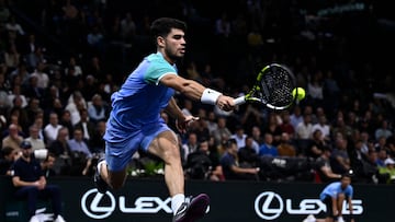 Spain's Carlos Alcaraz plays a forehand return to France's Ugo Humbert during their men's singles round of 16 match on day four of the Paris ATP Masters 1000 tennis tournament at the Accor Arena - Palais Omnisports de Paris-Bercy - in Paris on October 31, 2024. (Photo by JULIEN DE ROSA / AFP)