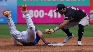 New York Mets first baseman Pete Alonso (20) dives back to first base as New York Yankees second baseman Oswald Peraza (91) applies the tag in the second inning at Clover Park.