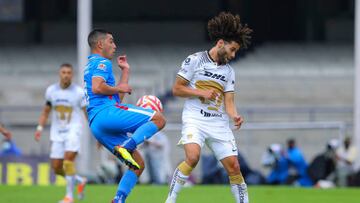 Erik Lira of Cruz Azul fights for the ball with Cesar Huerta of Pumas during the 15th round match between Pumas UNAM and Cruz Azul