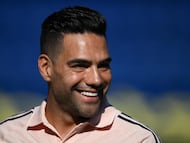 Colombian forward Radamel Falcao Garcia smiles during the warm-up session before the friendly football match between Argentina's Boca Juniors and Colombia's Millonarios in tribute to late Argentine coach Miguel Angel Russo at La Bombonera Stadium in Buenos Aires on January 14, 2026. (Photo by Luis ROBAYO / AFP)