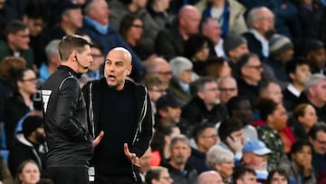 Manchester City's Spanish manager Pep Guardiola argues with line referee following the penalty given to aston Villa during the English Premier League football match between Manchester City and Aston Villa at the Etihad Stadium in Manchester, north west England, on April 22, 2025. (Photo by Oli SCARFF / AFP) / RESTRICTED TO EDITORIAL USE. No use with unauthorized audio, video, data, fixture lists, club/league logos or 'live' services. Online in-match use limited to 120 images. An additional 40 images may be used in extra time. No video emulation. Social media in-match use limited to 120 images. An additional 40 images may be used in extra time. No use in betting publications, games or single club/league/player publications. /