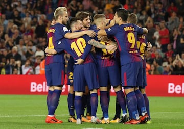 Barcelona celebrate their opening goal.