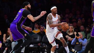 Jan 11, 2024; Los Angeles, California, USA; Phoenix Suns guard Bradley Beal (3) moves the ball against Los Angeles Lakers forward Anthony Davis (3) during the second half at Crypto.com Arena. Mandatory Credit: Gary A. Vasquez-USA TODAY Sports