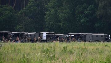 Army vehicles and soldiers are pictured at Nationaal Park Hoge Kempen in Dilsen-Stokkem on June 10, 2021 as researches are still underway for Jurgen Conings, 46, in the forested region close to the border with the Netherlands since finding his car abandon