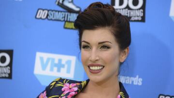 FILE - In this July 31, 2013 file photo Stevie Ryan arrives at the Do Something Awards at the Avalon in Los Angeles. Ryan, an actress and comedian who gained with impersonations of celebrities on YouTube, has died. She was 33. (Jordan Strauss/Invision/AP, File)