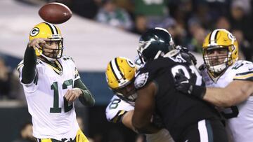 PHILADELPHIA, PA - NOVEMBER 28: Aaron Rodgers #12 of the Green Bay Packers passes the ball against Fletcher Cox #91 of the Philadelphia Eagles in the fourth quarter at Lincoln Financial Field on November 28, 2016 in Philadelphia, Pennsylvania.   Elsa/Getty Images/AFP
 == FOR NEWSPAPERS, INTERNET, TELCOS &amp; TELEVISION USE ONLY ==