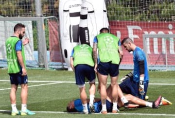 Cristiano Ronaldo being looked at by Madrid medics.