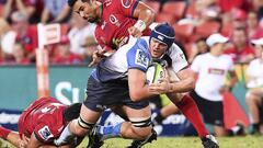 Waita Setu of the Queensland Reds tackles Ross Haylett-Petty of the Western Force during the Super Rugby match at Suncorp Stadium in Brisbane, Australia.