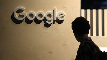 A woman passes the logo from the web search engine provider Google during the digital society festival 're:publica', at the Arena Berlin in Berlin, Germany June 9, 2022. REUTERS/Annegret Hilse