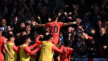 Brighton's Paraguayan striker Julio Enciso (C) celebrates with teammates in front of fans after scoring their second goal during the English Premier League football match between Chelsea and Brighton and Hove Albion at Stamford Bridge in London on April 15, 2023. (Photo by Ben Stansall / AFP) / RESTRICTED TO EDITORIAL USE. No use with unauthorized audio, video, data, fixture lists, club/league logos or 'live' services. Online in-match use limited to 120 images. An additional 40 images may be used in extra time. No video emulation. Social media in-match use limited to 120 images. An additional 40 images may be used in extra time. No use in betting publications, games or single club/league/player publications. / 