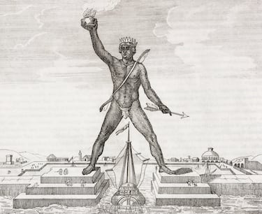 Fue la última maravilla del mundo antiguo construida y la que más rápido se destruyó. Era una impresionante estatua en honor al rey Helios (rey del sol), patrón de la isla de Rodas. 
La mayoría de las representaciones lo presentan como una imponente estatua de unos 32 metros de altura a horcajadas de la entrada del puerto, con un pie en cada pilar de manera que permitiría la entrada de los barcos entre sus piernas.