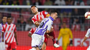 GIRONA, SPAIN - AUGUST 17: Alex Granell of Girona FC competes for the ball with Toni Villa of Real Valladolid CF during the La Liga match between Girona FC and Real Valladolid CF at Montilivi Stadium on August 17, 2018 in Girona, Spain. (Photo by David
