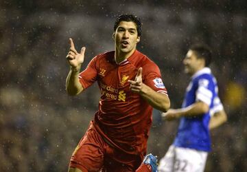 Liverpool's Luis Suarez celebrates after scoring a goal against Everton during their English Premier League soccer match at Anfield in Liverpool