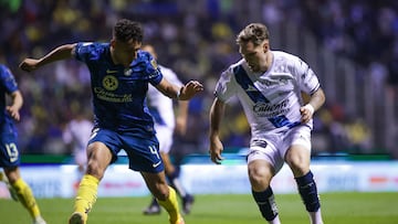 Sebastian Caceres (L) of America fights for the ball with Emiliano Gomez (R) of Puebla during the 6th round match between Puebla and America as part of the Liga BBVA MX, Torneo Clausura 2025 at Cuauhtemoc Stadium, on February 07, 2025 in Puebla, Mexico.