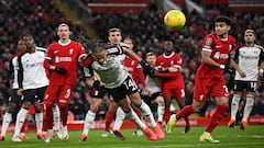 Fulham's Jamaican striker #14 Bobby Decordova-Reid headers the ball clear during the English League Cup semi-final first leg football match between Liverpool and Fulham at Anfield in Liverpool, north west England on January 10, 2024. (Photo by Paul ELLIS / AFP) / RESTRICTED TO EDITORIAL USE. No use with unauthorized audio, video, data, fixture lists, club/league logos or 'live' services. Online in-match use limited to 120 images. An additional 40 images may be used in extra time. No video emulation. Social media in-match use limited to 120 images. An additional 40 images may be used in extra time. No use in betting publications, games or single club/league/player publications. / 