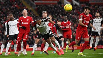 Fulham's Jamaican striker #14 Bobby Decordova-Reid headers the ball clear during the English League Cup semi-final first leg football match between Liverpool and Fulham at Anfield in Liverpool, north west England on January 10, 2024. (Photo by Paul ELLIS / AFP) / RESTRICTED TO EDITORIAL USE. No use with unauthorized audio, video, data, fixture lists, club/league logos or 'live' services. Online in-match use limited to 120 images. An additional 40 images may be used in extra time. No video emulation. Social media in-match use limited to 120 images. An additional 40 images may be used in extra time. No use in betting publications, games or single club/league/player publications. / 