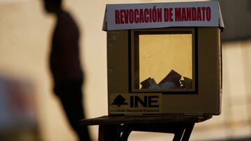 A shadow of a person casts behind a ballot box at a polling station during a referendum on whether President Andres Manuel Lopez Obrador should continue in office, in Ciudad Juarez, Mexico April 10, 2022. REUTERS/Jose Luis Gonzalez