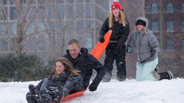 Anson Call, 43, of Brooklyn, sleds with his child in the snow during a Nor'easter storm in Brooklyn, New York City.