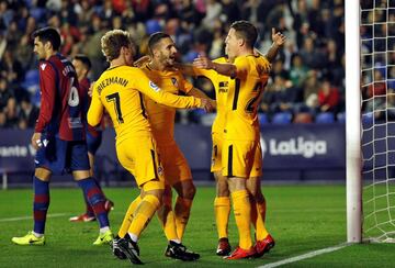 Atlético's players celebrate taking the lead.