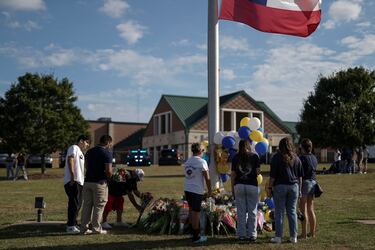 Why has the father of the suspected Apalachee High School shooter been arrested?