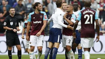Tottenham Hotspur's Spanish striker Fernando Llorente (L) skirmishes with West Ham United's New Zealand defender Winston Reid during the English Premier League football match between West Ham United and Tottenham Hotspur at The London Stadium, in east London on September 9, 2017. / AFP PHOTO / Ian KINGTON / RESTRICTED TO EDITORIAL USE. No use with unauthorized audio, video, data, fixture lists, club/league logos or 'live' services. Online in-match use limited to 75 images, no video emulation. No use in betting, games or single club/league/player publications. /