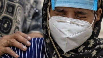 FILE PHOTO: Huma cries as she waits to speak with her grandmother Salma, a coronavirus disease (COVID-19) patient, using a video calling facility provided by the authorities to connect with COVID-19 patients at the LNJP hospital, in New Delhi India, July