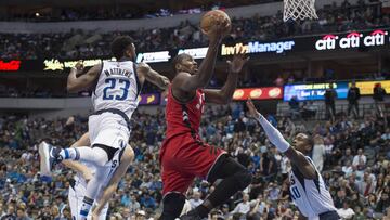 Mar 25, 2017; Dallas, TX, USA; Toronto Raptors forward Serge Ibaka (9) drives to the basket past Dallas Mavericks guard Wesley Matthews (23) and forward Harrison Barnes (40) during the second half at the American Airlines Center. The Raptors defeat the Mavericks 94-86. Mandatory Credit: Jerome Miron-USA TODAY Sports