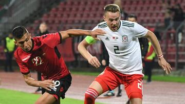 Wales&#039; defender Chris Gunter (R) vies for the ball with Albania&#039;s forward Myrto Uzuni (L) during the friendly football match between Albania and Wales at the Elbasan Arena Stadium in Elbasan on November 20, 2018. (Photo by Gent SHKULLAKU / AFP)