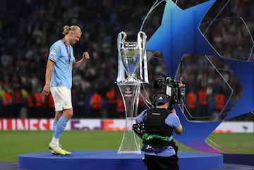 ISTANBUL, TURKIYE - JUNE 11: Erling Haaland of Manchester City is seen near the UEFA Champions League trophy after the team's victory in the UEFA Champions League 2022/23 final match against Inter at Ataturk Olympic Stadium on June 11, 2023 in Istanbul, Turkiye. (Photo by Ali Atmaca/Anadolu Agency via Getty Images)