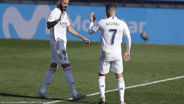 MADRID, SPAIN - OCTOBER 31: Eden Hazard of Real Madrid celebrates with teammate Karim Benzema after scoring his team's first goal during the La Liga Santander match between Real Madrid and SD Huesca at Estadio Santiago Bernabeu on October 31, 2020 in Madr