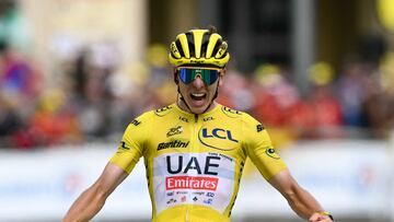 UAE Team Emirates team's Slovenian rider Tadej Pogacar wearing the overall leader's yellow jersey cycles to the finish line to win the 14th stage of the 111th edition of the Tour de France cycling race, 151,9 km between Pau and Saint-Lary-Soulan Pla d'Adet, in the Pyrenees mountains in southwestern France, on July 13, 2024. (Photo by Marco BERTORELLO / AFP)