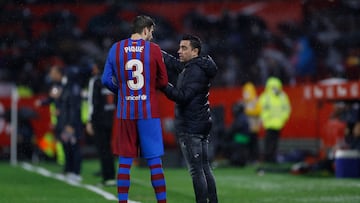 Gerard Piqué y Xavi Hernández.