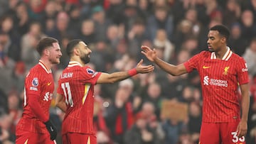 LIVERPOOL, ENGLAND - DECEMBER 26: Mohamed Salah of Liverpool (C) celebrates scoring his team's third goal with teammates Alexis Mac Allister (L) and Ryan Gravenberch (R) during the Premier League match between Liverpool FC and Leicester City FC at Anfield on December 26, 2024 in Liverpool, England. (Photo by Jan Kruger/Getty Images)