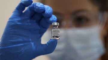 A nurse holds a phial of the Pfizer-BioNTech COVID-19 vaccine at Guy's Hospital in London, Tuesday, Dec. 8, 2020, as the U.K. health authorities rolled out a national mass vaccination program. U.K. regulators said Wednesday Dec. 9, 2020, that people who have a “significant history’’ of allergic reactions shouldn’t receive the new Pfizer/BioNTech vaccine while they investigate two adverse reactions that occurred on the first day of the country’s mass vaccination program. (AP Photo/Frank Augstein, Pool)
