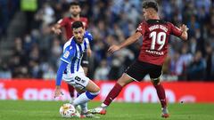 SAN SEBASTIAN, SPAIN - NOVEMBER 21: Mikel Merino of Real Sociedad battles for possession with Hugo Duro of Valencia CF during the La Liga Santander match between Real Sociedad and Valencia CF at Reale Arena on November 21, 2021 in San Sebastian, Spain. (P