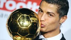 Manchester United Portuguese winger Cristiano Ronaldo poses with his trophy after he received the European footballer of the year award, the &quot;Ballon d&#039;Or&quot; (Golden ball), on December 7, 2008 in Boulogne-Billancourt, outside Paris. Ronaldo beat Barcelona&#039;s Lionel Messi and Liverpool striker Fernando Torres to the honour on the back of a phenomenal 2007-08 season in which he scored 42 goals for his Premier League and Champions League-winning club. Ronaldo becomes the first United player to win the award since the late George Best in 1968. AFP PHOTO FRANCK FIFE